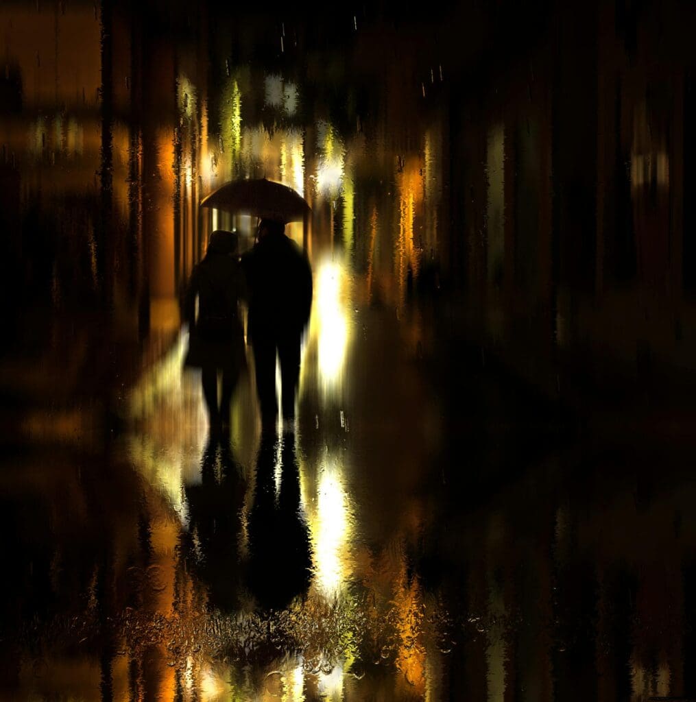 Two people walk under an umbrella on a rainy night, illuminated by blurred streetlights, with reflections visible on the wet ground.